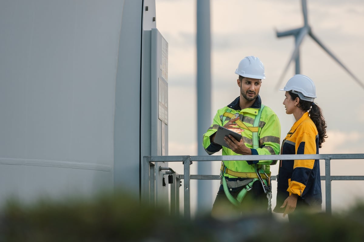 Engineers discussing wind turbine operations